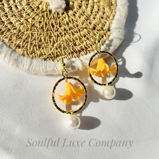 Orange Puakenikeni with white shell pearl , hoop